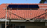 Canadian Solar black solar panel array on roof