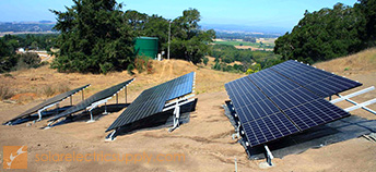 ground-mounted solar panel system on hill